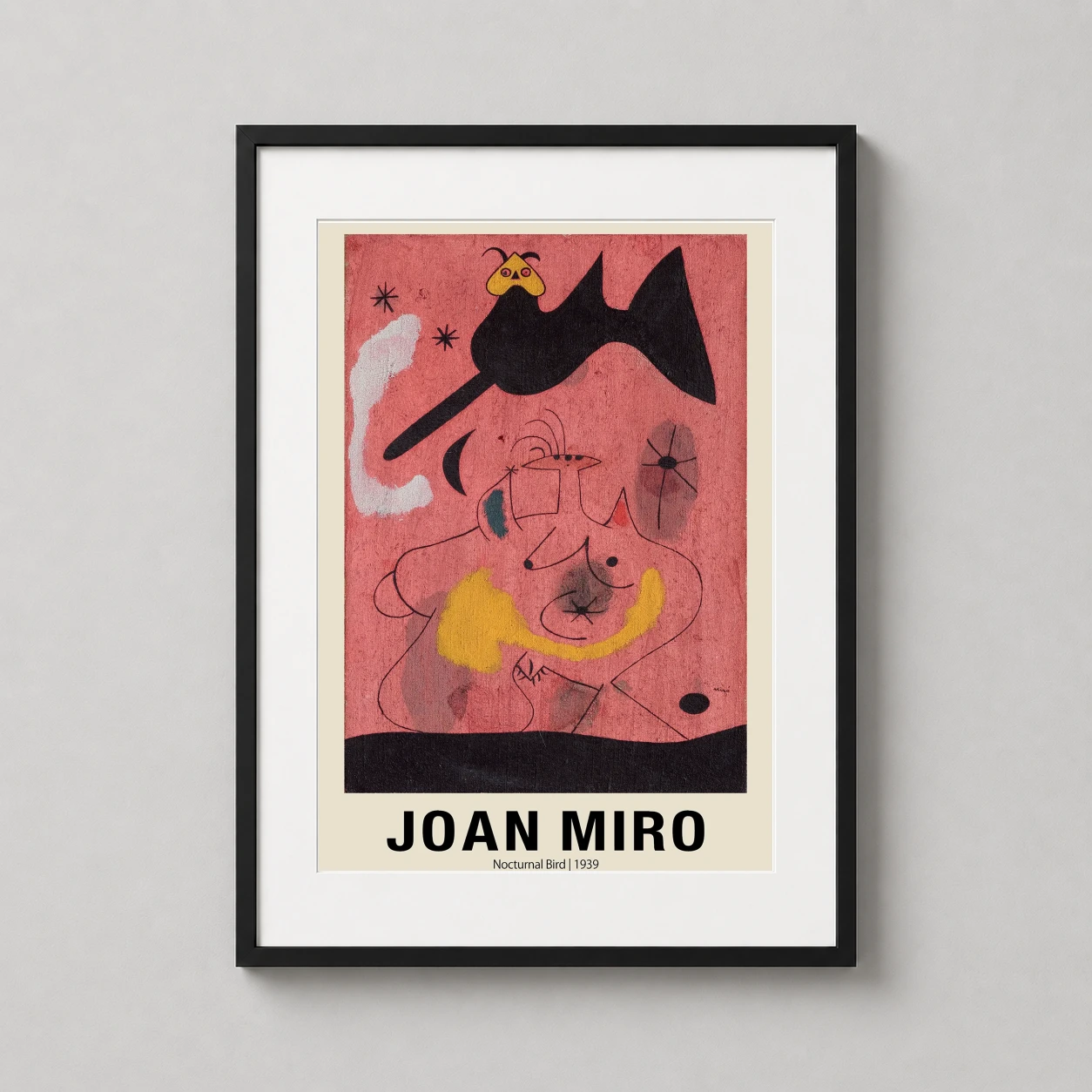 Room mockup of Joan Miro Nocturnal Bird 1939 Abstract Surrealist Art Print, displayed as framed wall art in a bedroom setting as a portrait print with red and black tones.