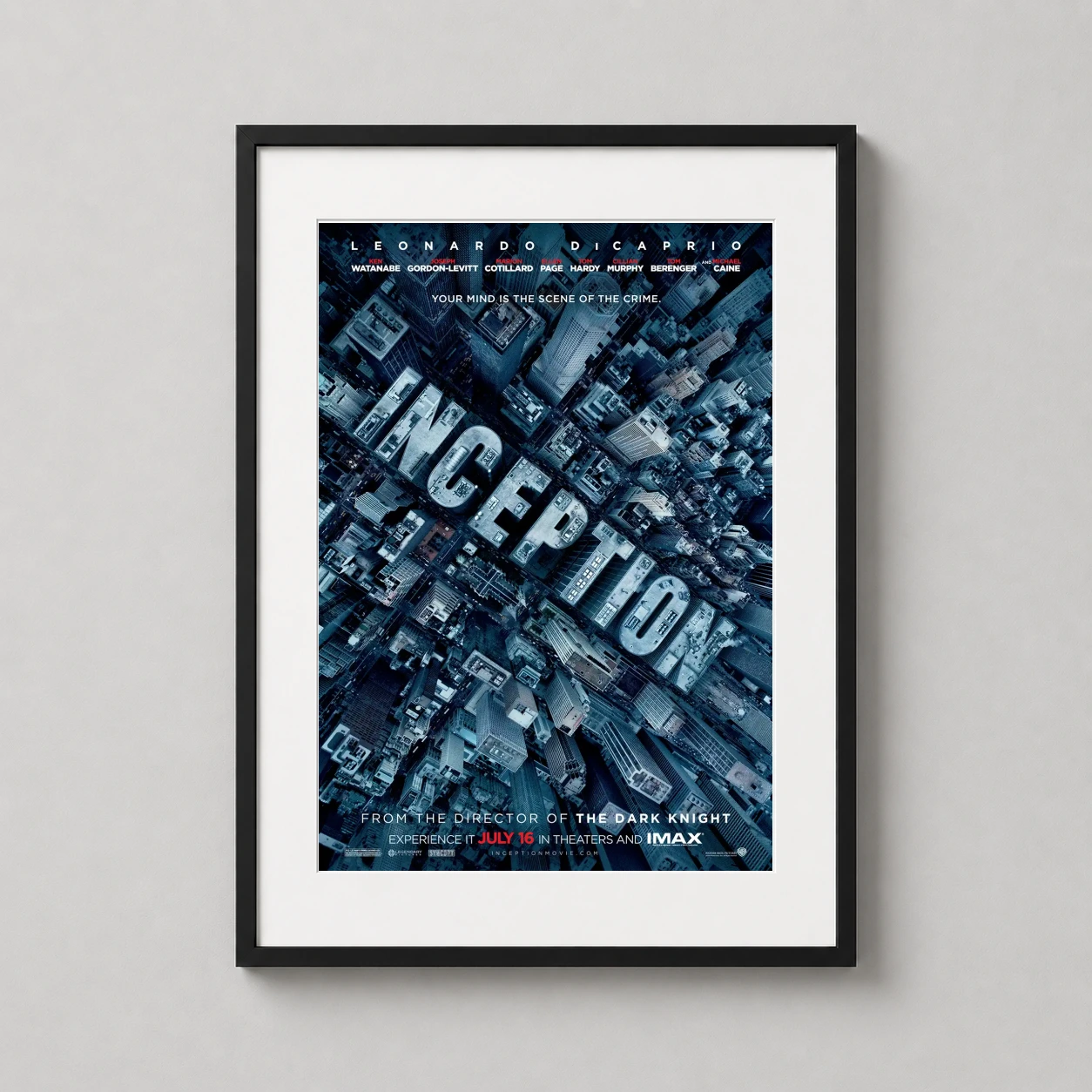 Inception — theatrical Inception movie poster featuring a top-down urban view where