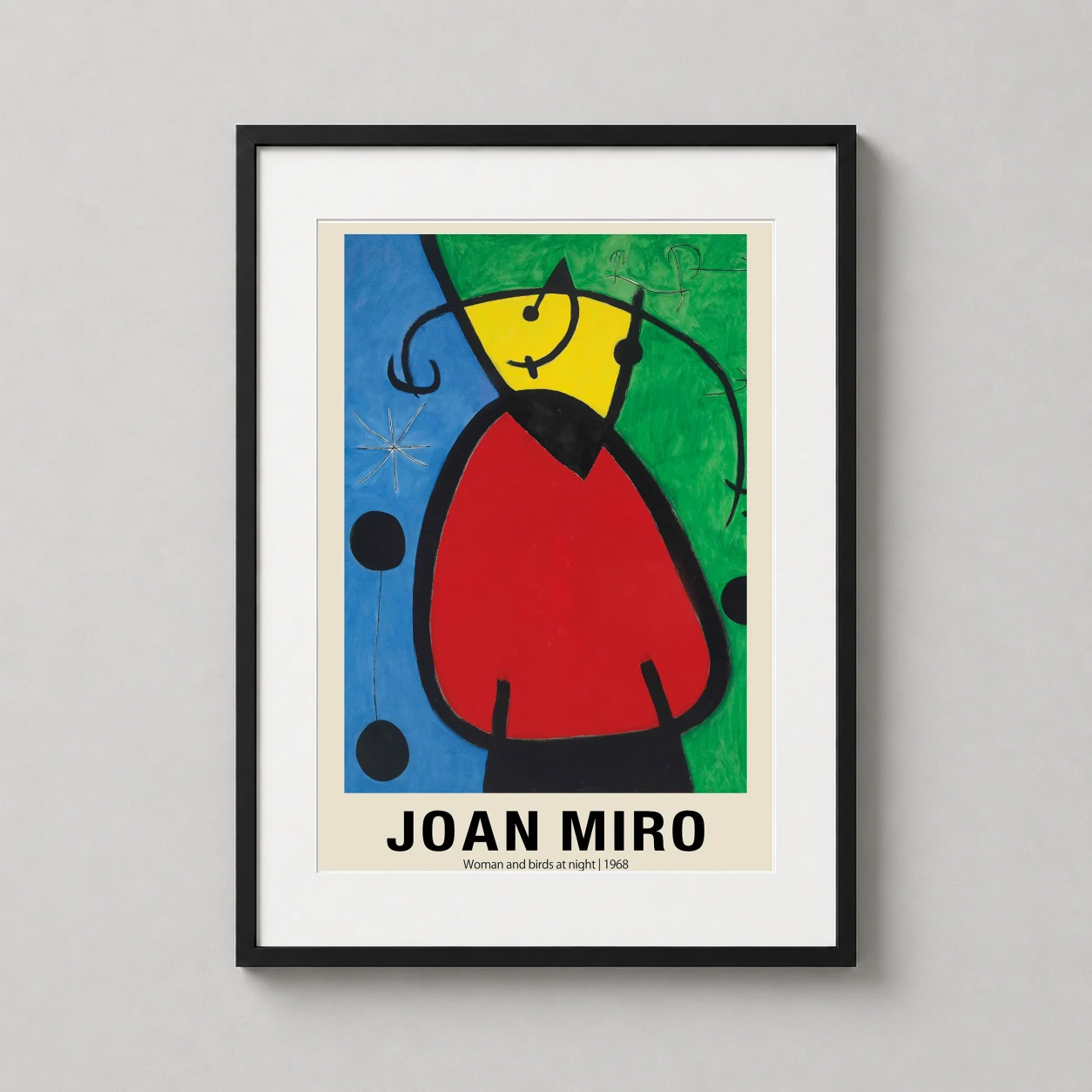 Room mockup of Joan Miro Woman and Birds at Night 1968 Abstract Art Print, displayed as framed wall art in a bedroom setting as a portrait print with blue and green tones.