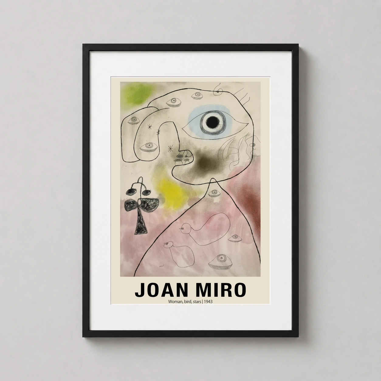 Room mockup of Joan Miro Woman, Bird, Stars 1943 Surrealist Abstract Art Print, displayed as framed wall art in a bedroom setting as a portrait print with green and yellow tones.
