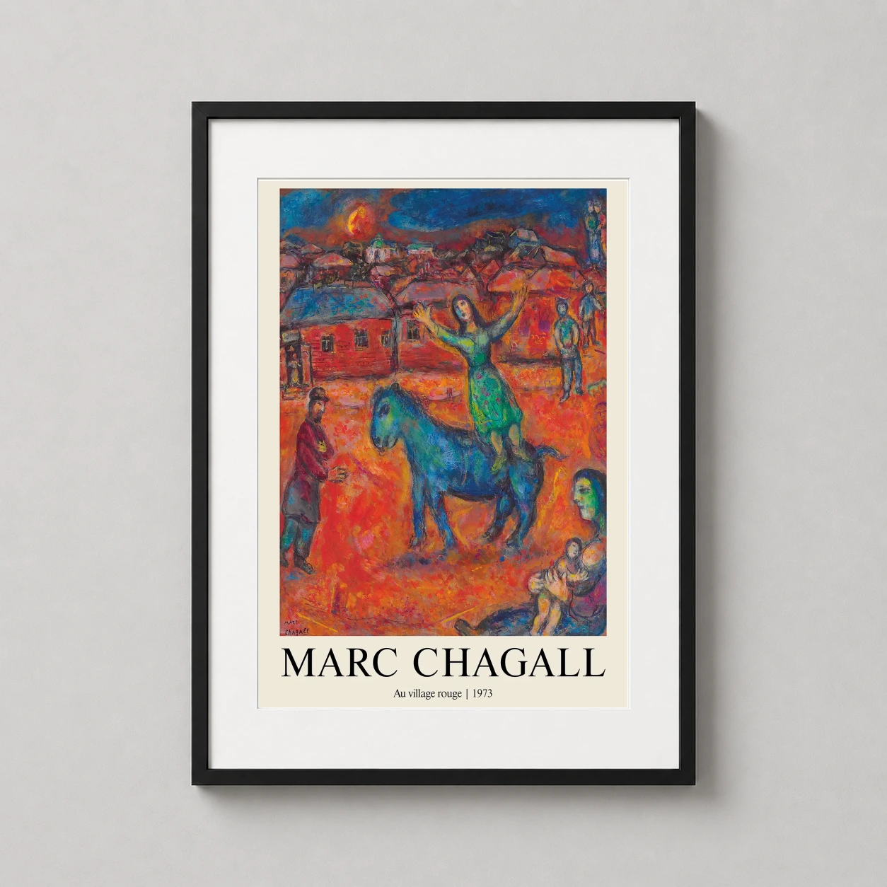 Room mockup of Marc Chagall Au village rouge 1973 Expressionist Art Print, displayed as framed wall art in a living room setting as a portrait print with blue and red tones.