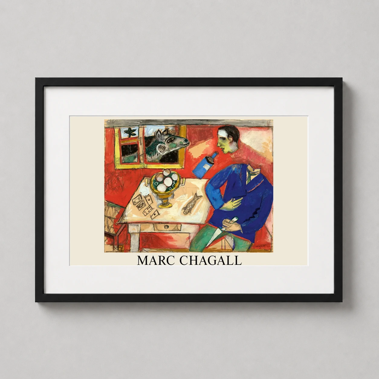 Room mockup of Marc Chagall, Le Saoul 1912 Cubist Surrealism Art Print, displayed as framed wall art in a living room setting as a landscape print with blue and red tones.