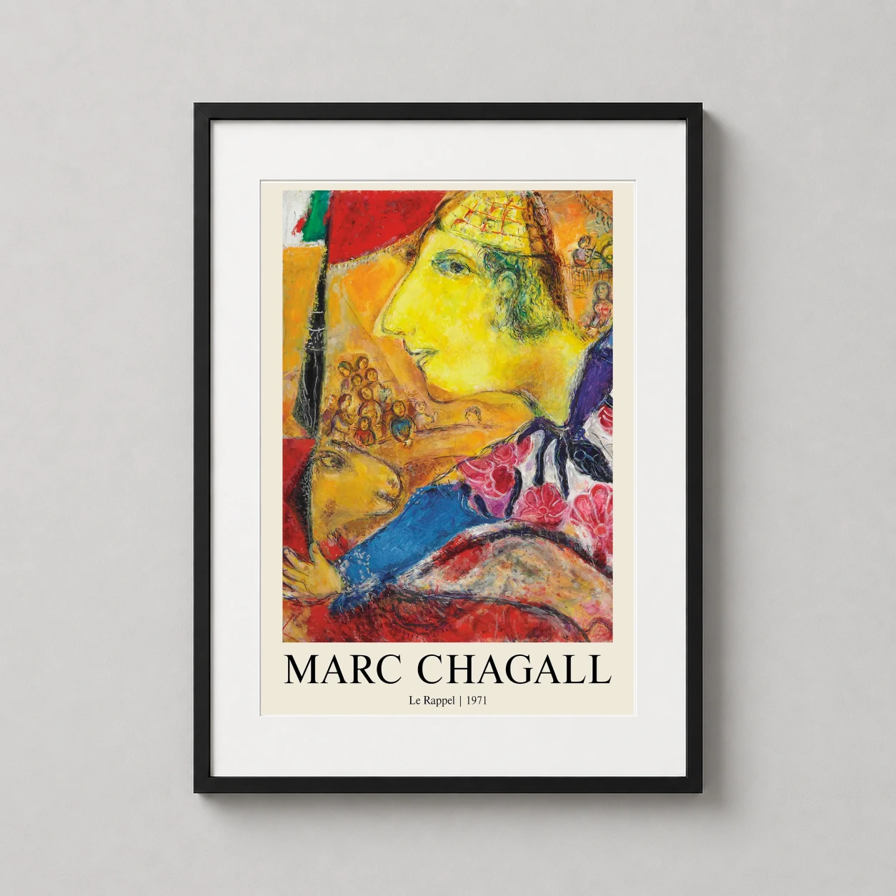 Room mockup of Marc Chagall Le Rappel Surrealist Exhibition Poster Art Print, displayed as framed wall art in a living room setting as a portrait print with blue, yellow, and red tones.