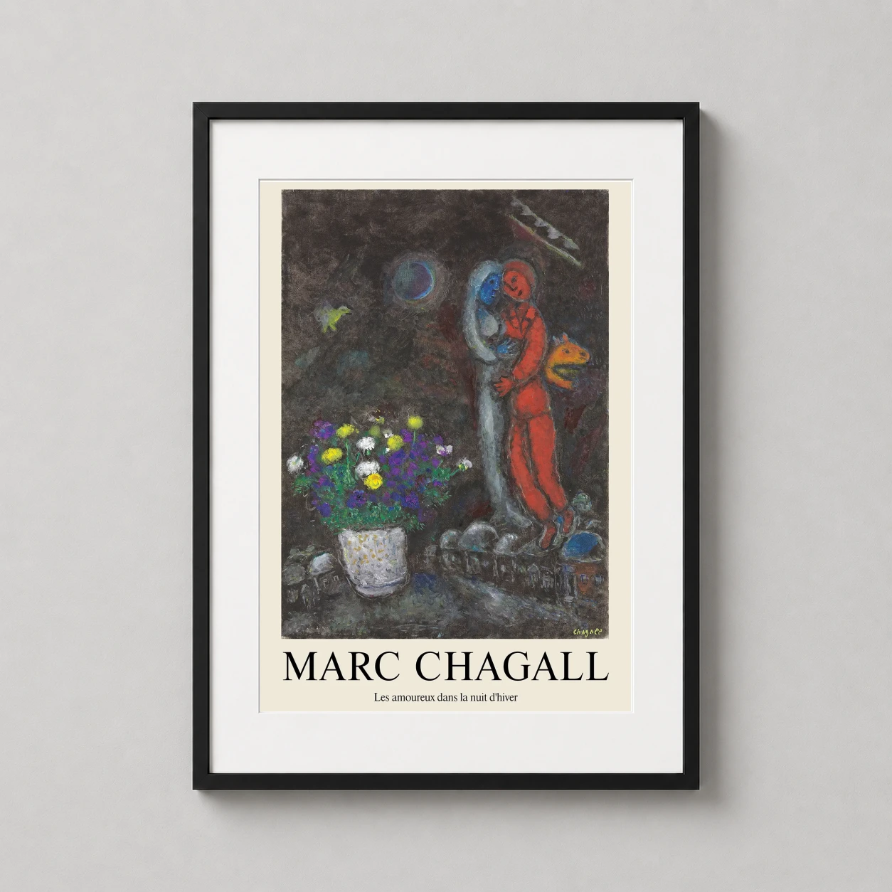 Room mockup of Marc Chagall Les amoureux dans la nuit d'hiver, Expressionist Art Print, displayed as framed wall art in a living room setting as a portrait print with blue, yellow, and red tones.