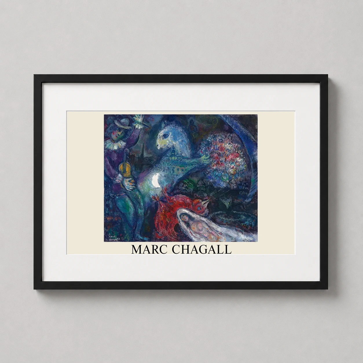 Room mockup of Marc Chagall La Nuit Enchantée 1964 Surrealist Fine Art Print, displayed as framed wall art in a living room setting as a landscape print with blue and white tones.