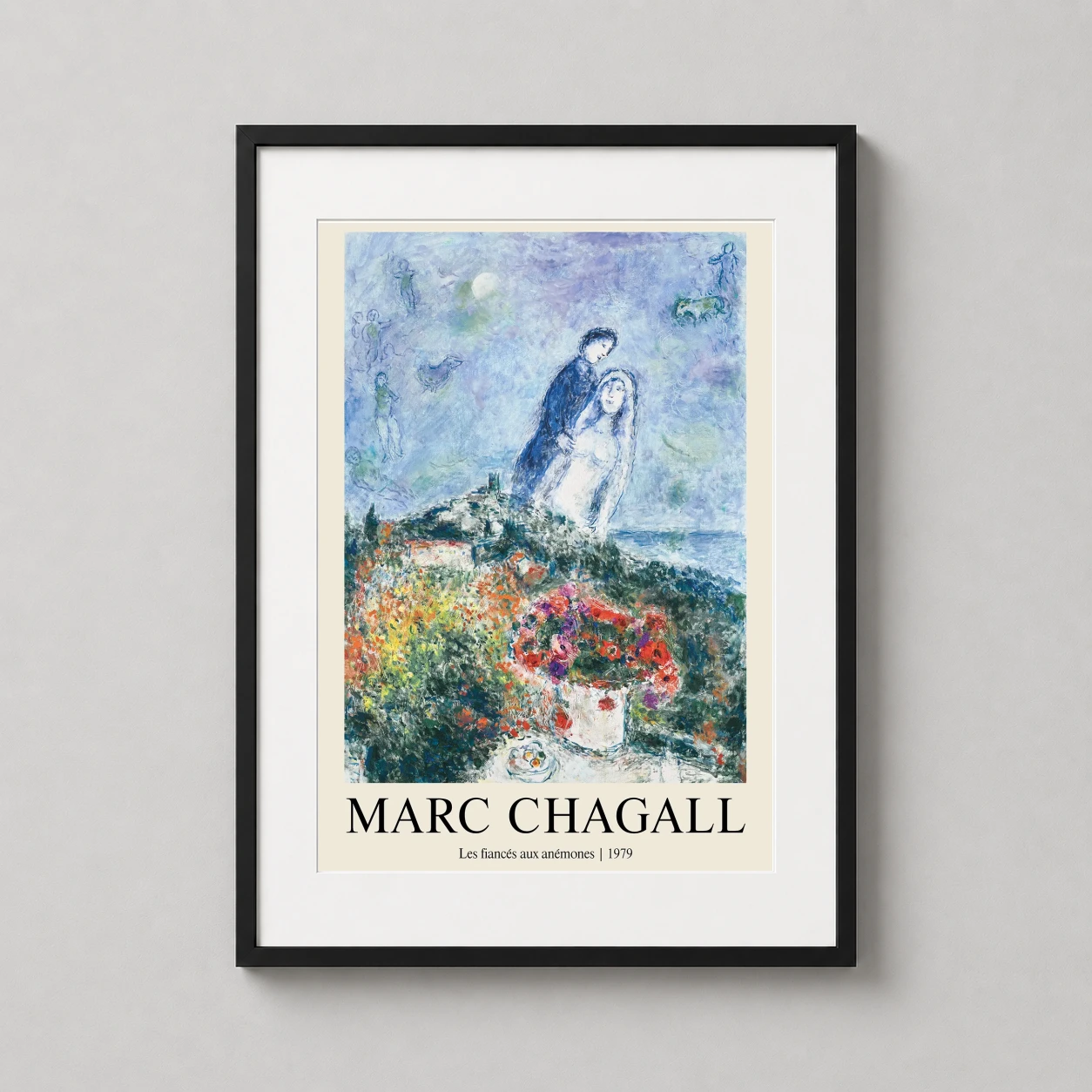 Room mockup of Marc Chagall Les Fiances aux Anemones 1979 Surrealist Art Print, displayed as framed wall art in a living room setting as a portrait print with blue and red tones.