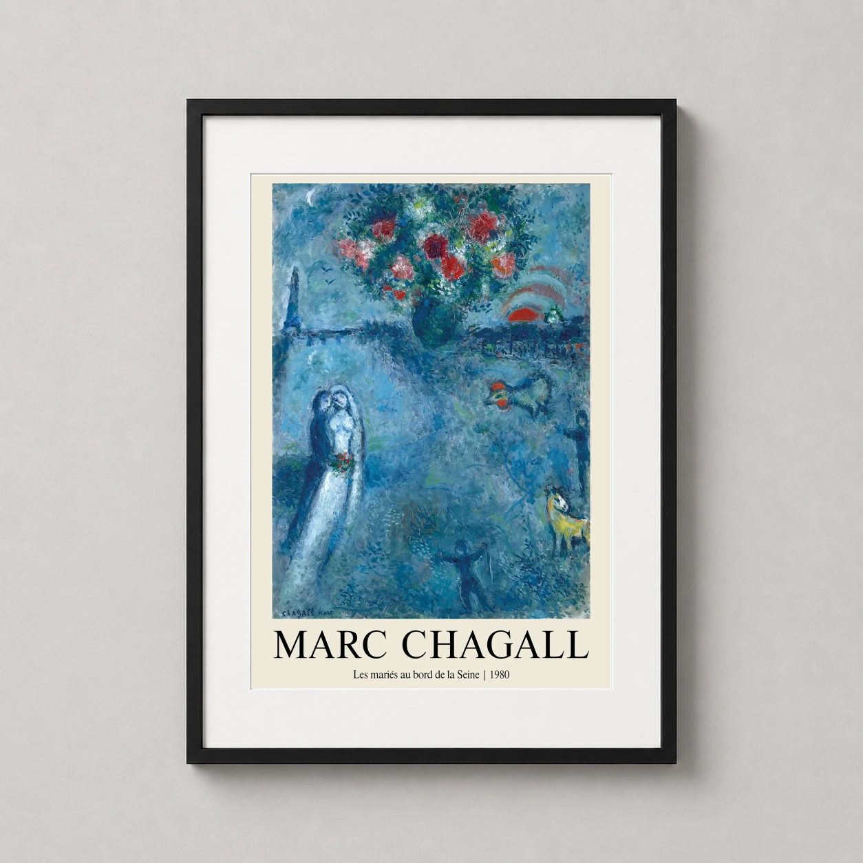 Room mockup of Marc Chagall Les Maries au Bord de la Seine 1980 Art Print, displayed as framed wall art in a living room setting as a portrait print with blue tones.