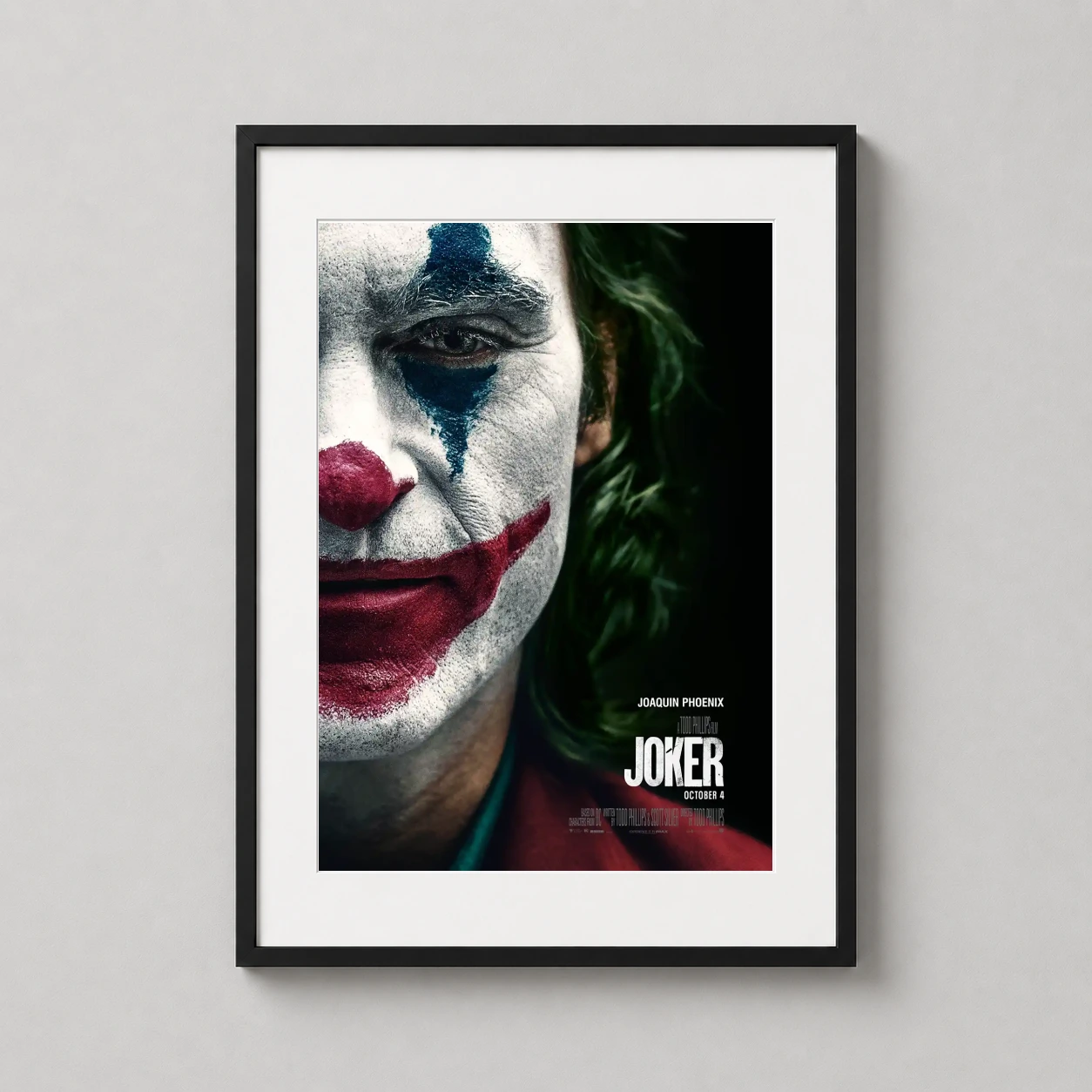 Joker 2019 Joaquin Phoenix — high-contrast close-up of Joaquin Phoenix in character makeup