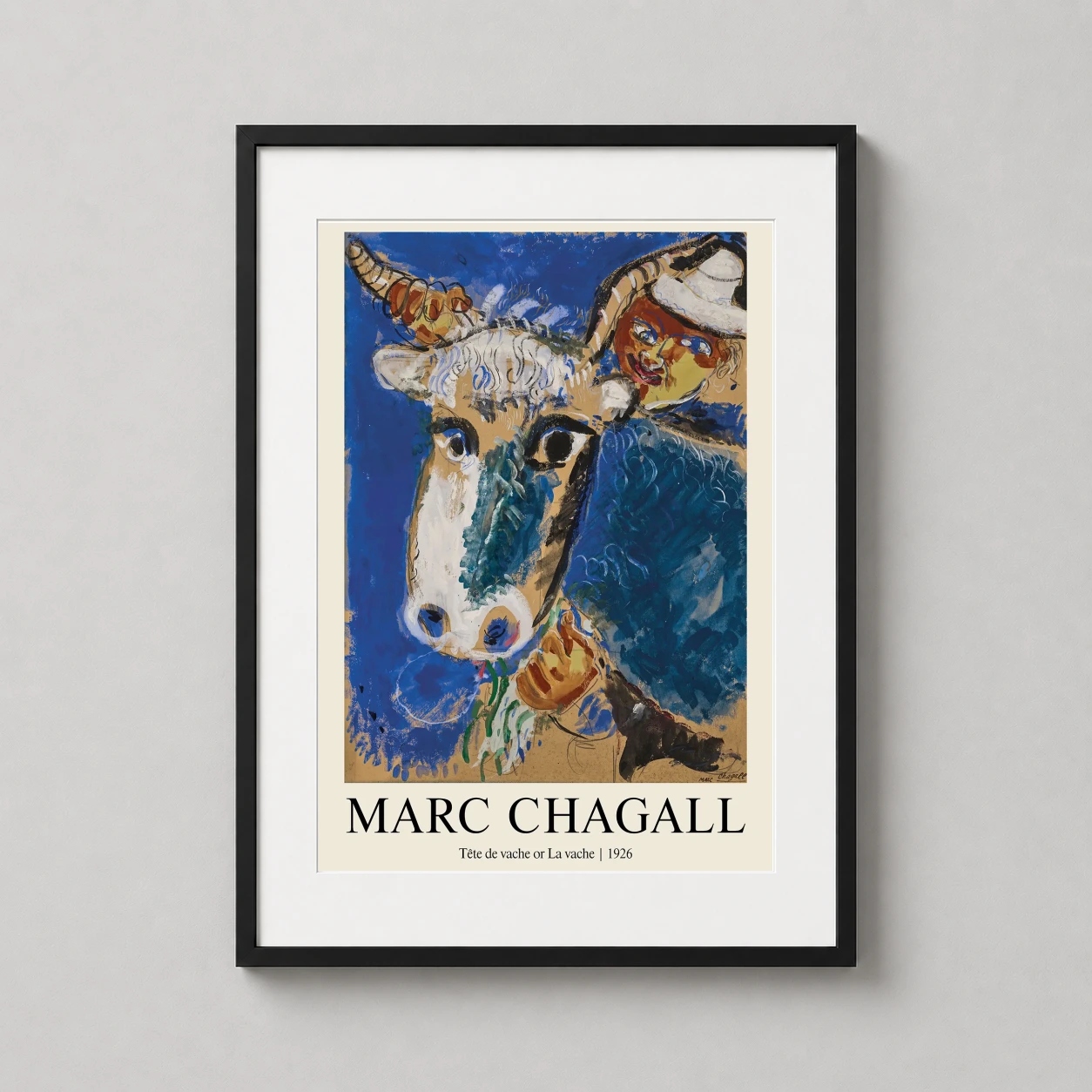 Room mockup of Marc Chagall Tête de vache 1926 Expressionist Art Print, displayed as framed wall art in a living room setting as a portrait print with blue tones.