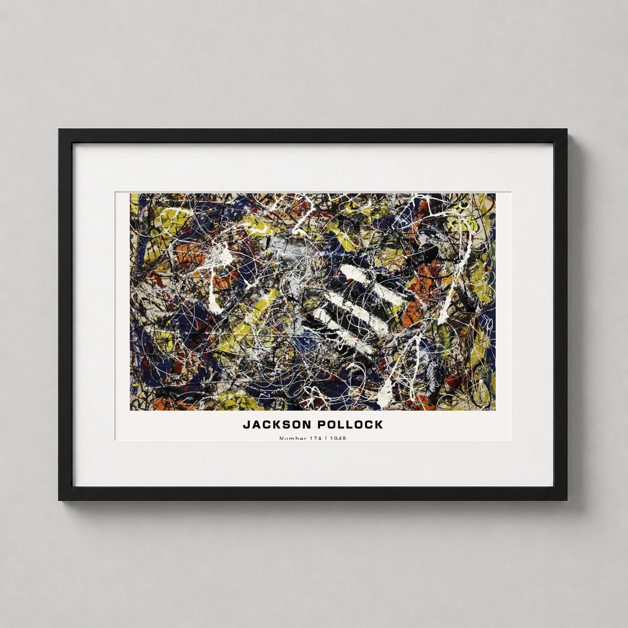 Room mockup of Jackson Pollock Number 17A 1948 Abstract Expressionist Art Print, displayed as framed wall art in a living room setting as a landscape print with blue, yellow, and white tones.