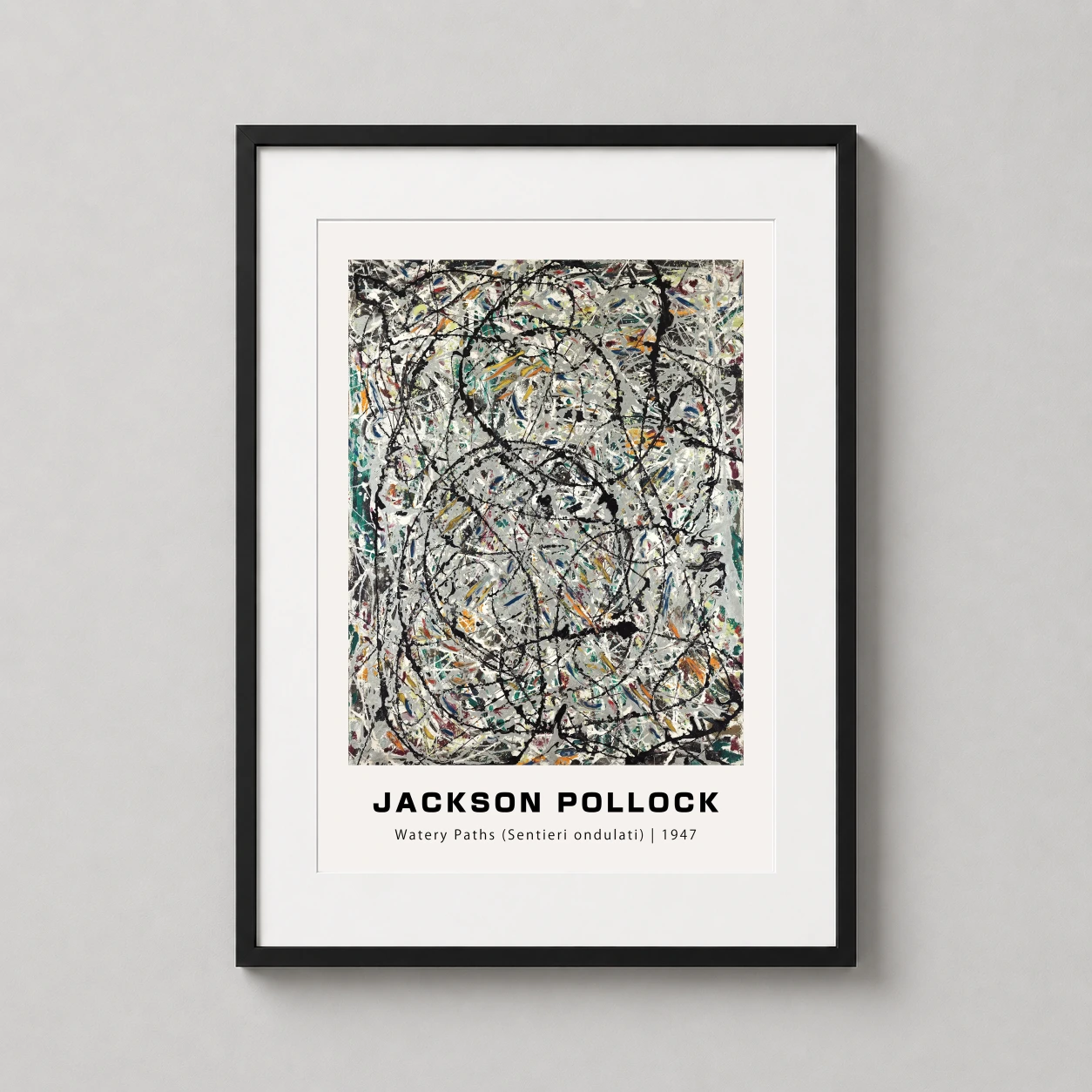 Room mockup of Jackson Pollock Watery Paths (1947) Abstract Expressionist Art Print, displayed as framed wall art in a living room setting as a portrait print with blue, grey, and black tones.