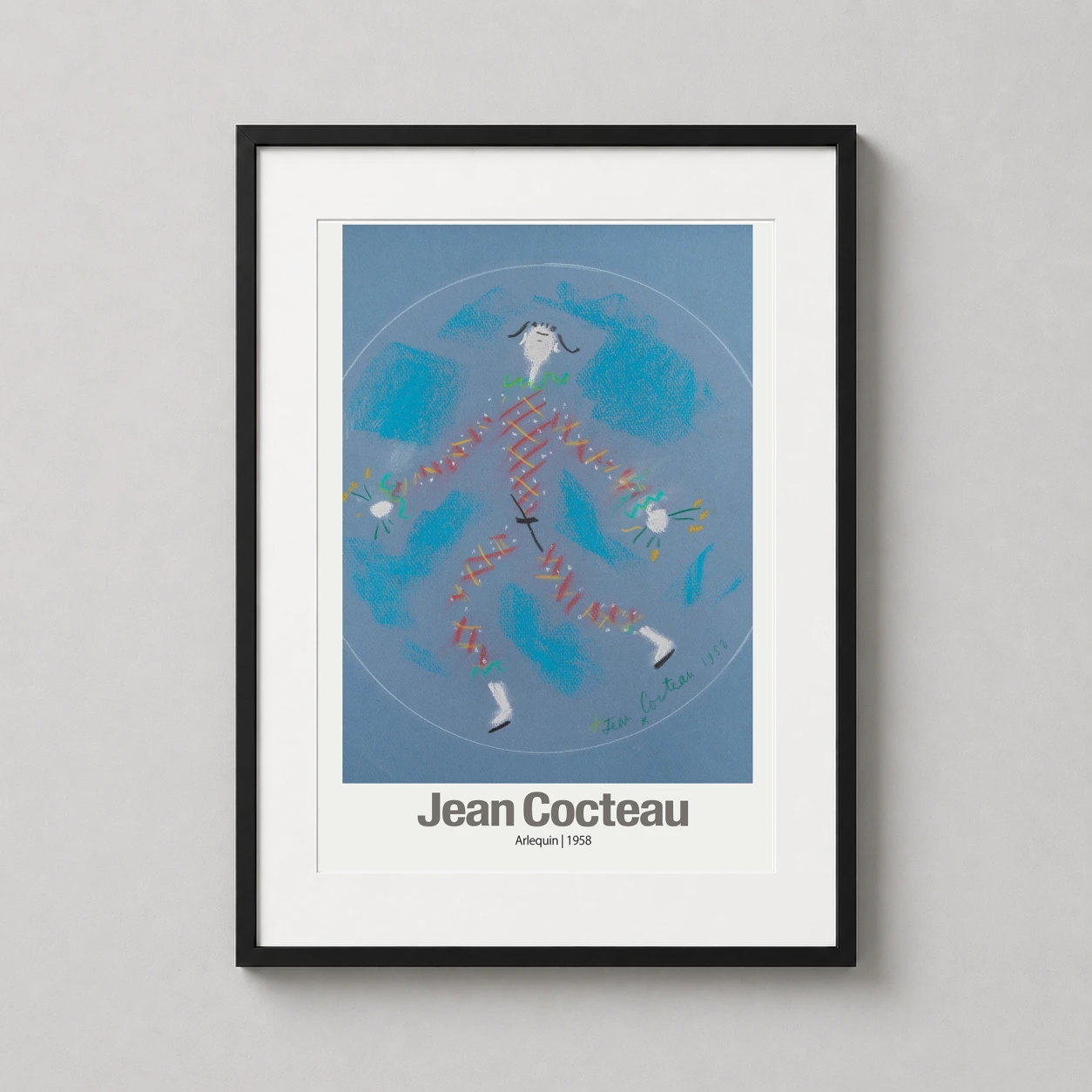 Room mockup of Jean Cocteau Arlequin 1958, Modernist Harlequin Fine Art Print, displayed as framed wall art in a living room setting as a portrait print with blue tones.