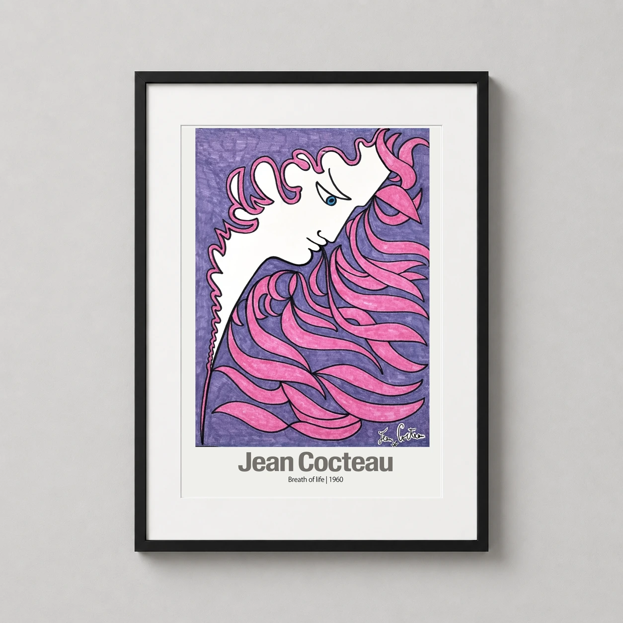 Room mockup of Jean Cocteau Breath of Life 1960 Surrealist Modern Art Print, displayed as framed wall art in a living room setting as a portrait print with pink and purple tones.