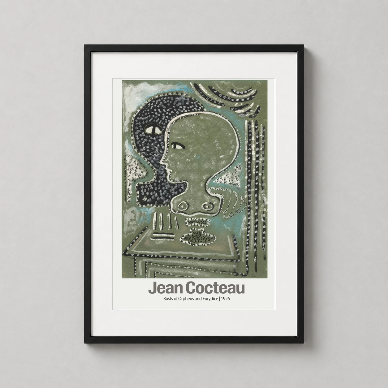 Room mockup of Jean Cocteau Busts of Orpheus and Eurydice 1926 Surrealist Art Print, displayed as framed wall art in a living room setting as a portrait print with green tones.