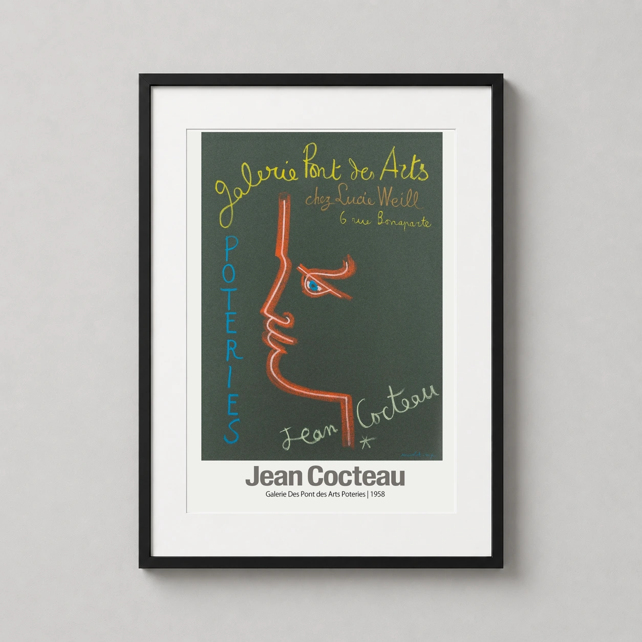 Room mockup of Jean Cocteau Galerie Des Pont des Arts 1958 Exhibition Art Print, displayed as framed wall art in a living room setting as a portrait print with blue and orange tones.