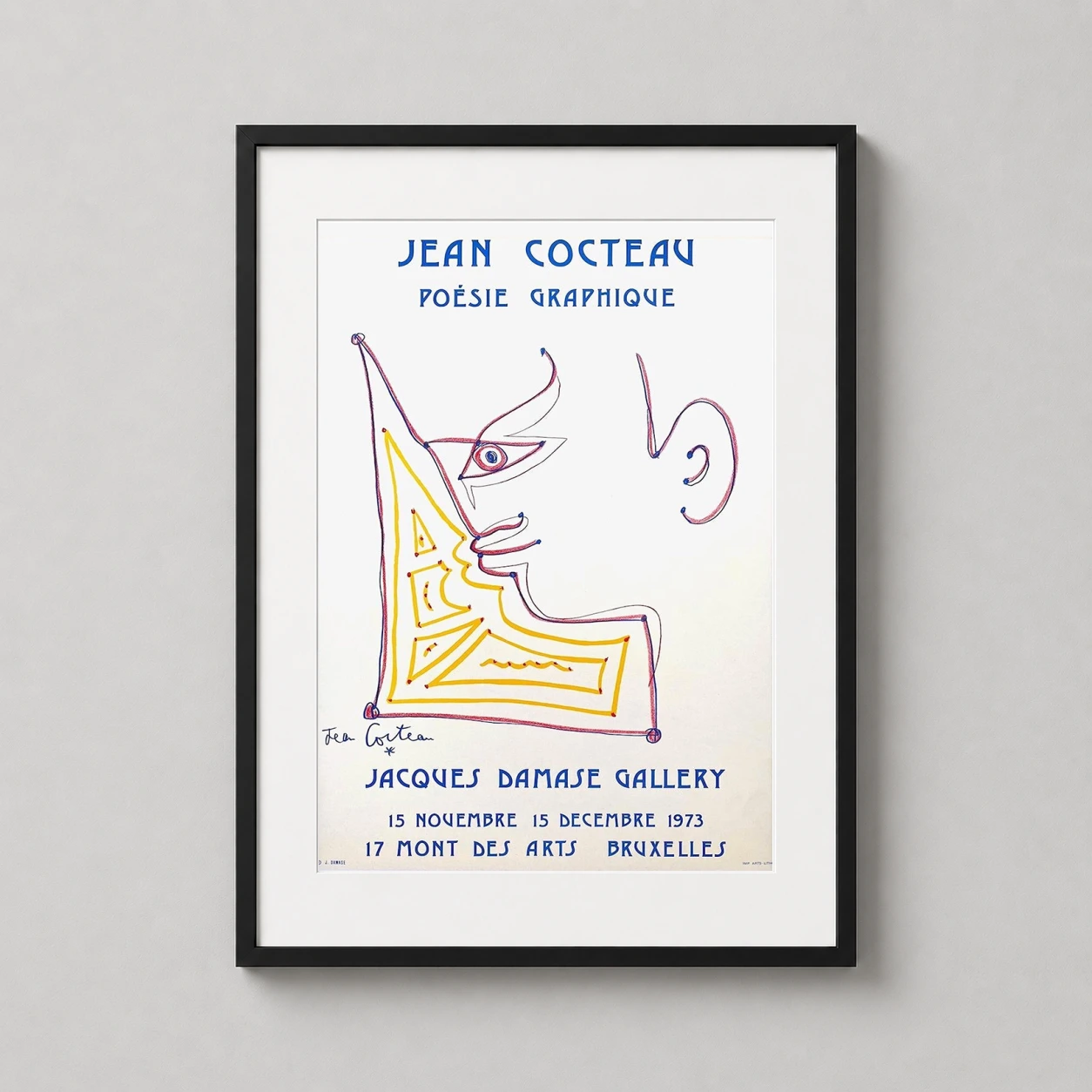 Room mockup of Jean Cocteau 1973 Jacques Damase Gallery Exhibition Art Print, displayed as framed wall art in a living room setting as a portrait print with blue, yellow, and red tones.