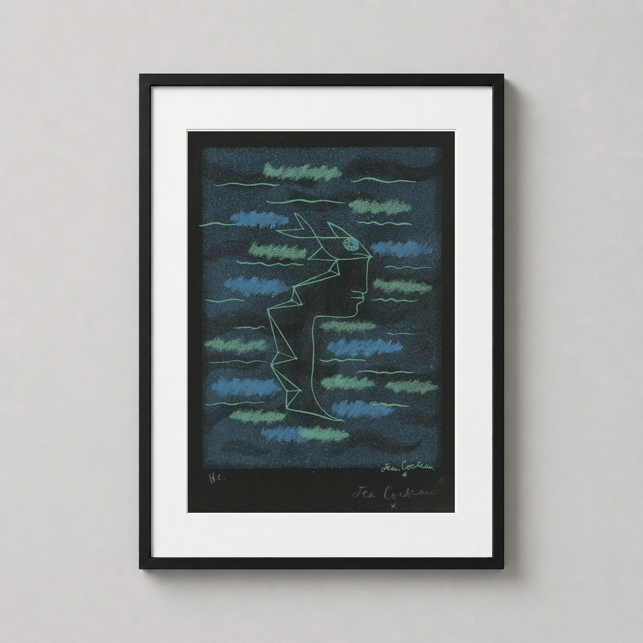 Room mockup of Jean Cocteau Tête Profil Vert Bleu 1940 Abstract Art Print, displayed as framed wall art in a living room setting as a portrait print with teal and green tones.