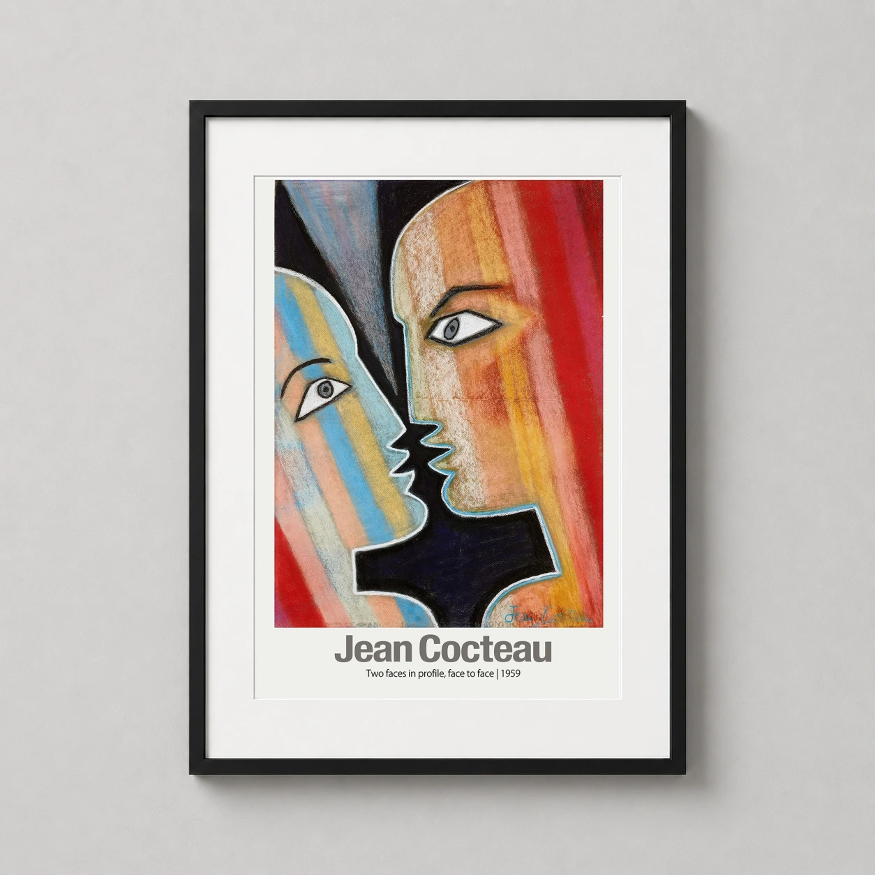 Room mockup of Jean Cocteau Two Faces in Profile 1959 Abstract Art Print, displayed as framed wall art in a living room setting as a portrait print with blue, yellow, and red tones.