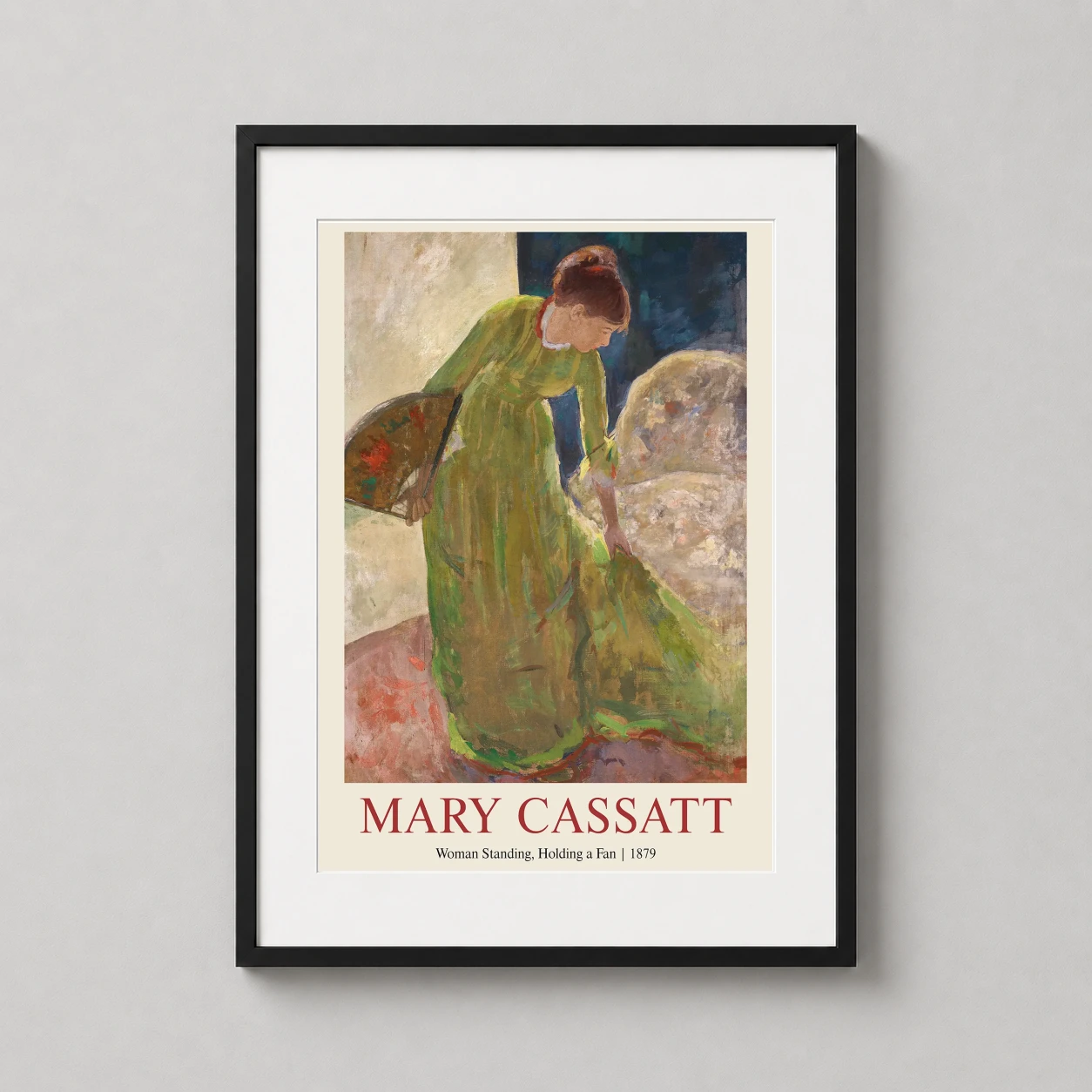 Room mockup of Mary Cassatt, Woman Standing Holding a Fan, 1879 Art Print, displayed as framed wall art in a living room setting as a portrait print with green tones.