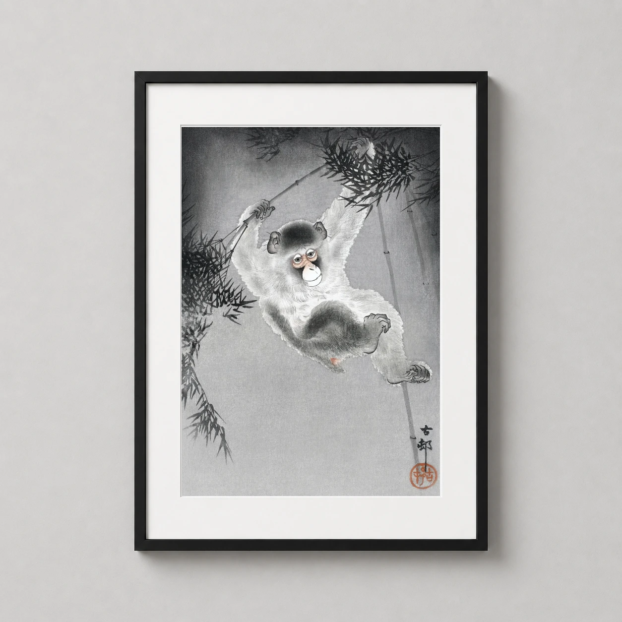 Room mockup of Japanese Monkey Hanging from Bamboo Branch Art Print, displayed as framed wall art in a bedroom setting as a portrait print with grey and white tones.