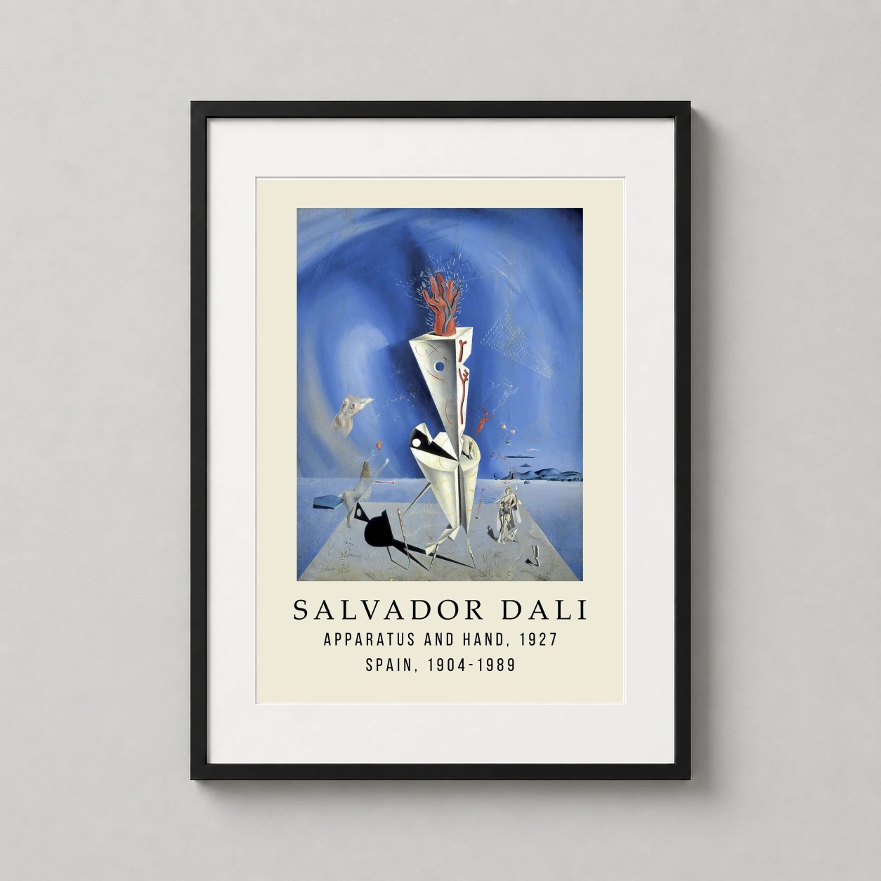 Room mockup of Salvador Dali Apparatus and Hand 1927 Surrealist Art Print, displayed as framed wall art in a living room setting as a portrait print with blue and red tones.