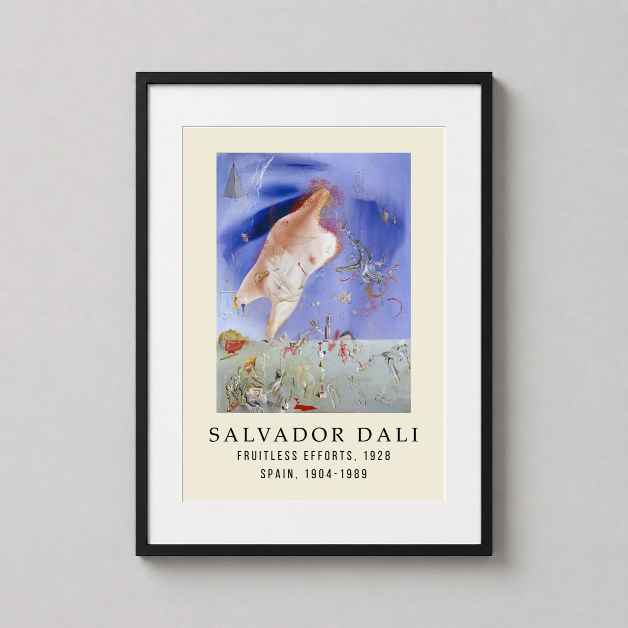 Room mockup of Salvador Dali Fruitless Efforts 1928 Surrealist Art Print, displayed as framed wall art in a living room setting as a portrait print with blue and grey tones.