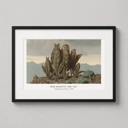 A framed art print of Magritte's Companions of Fear hanging in a sophisticated home office with dark wood furniture.