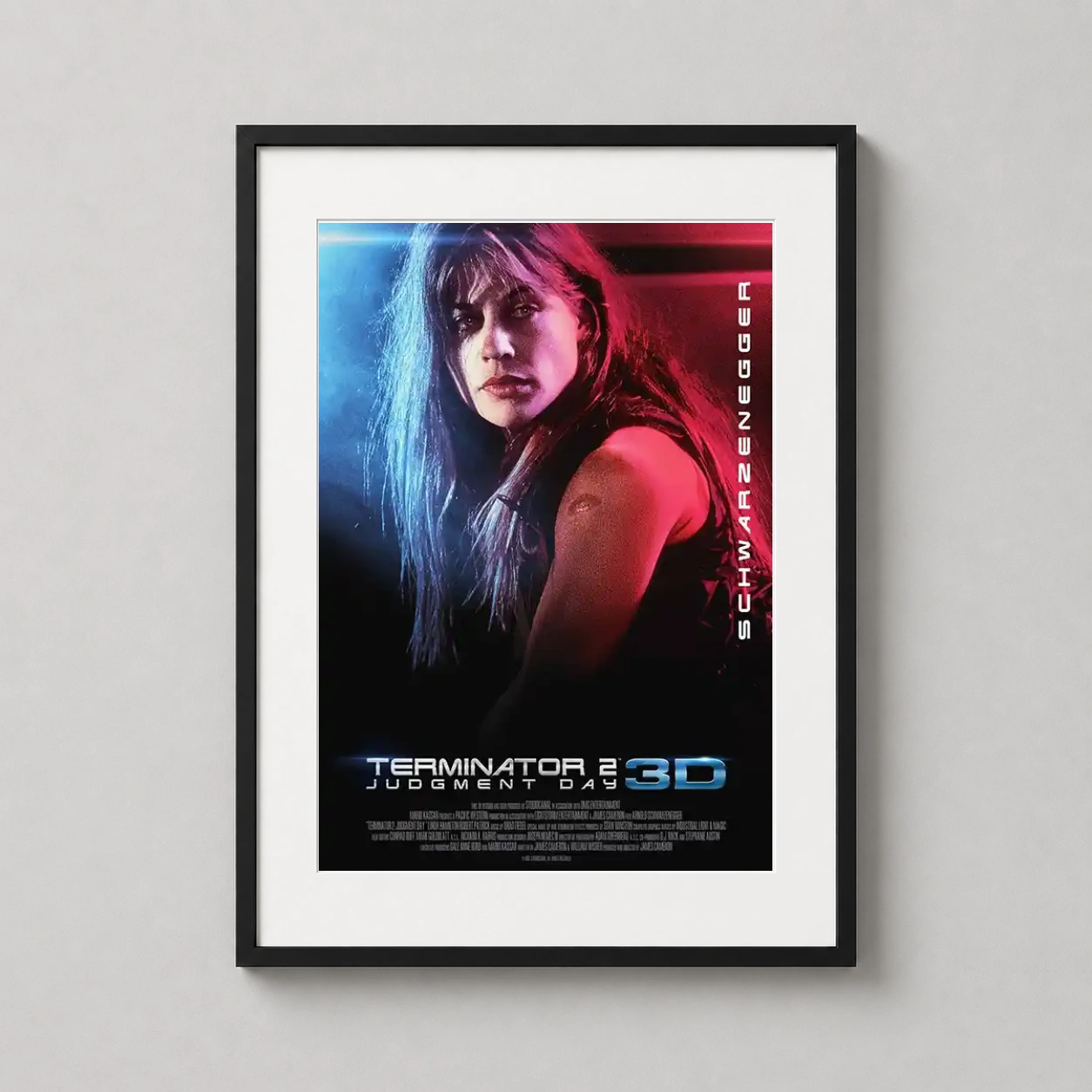 Room mockup of Terminator 2 Sarah Connor Neon Movie Poster, displayed as framed wall art in a home theater setting as a portrait print with blue and red tones.