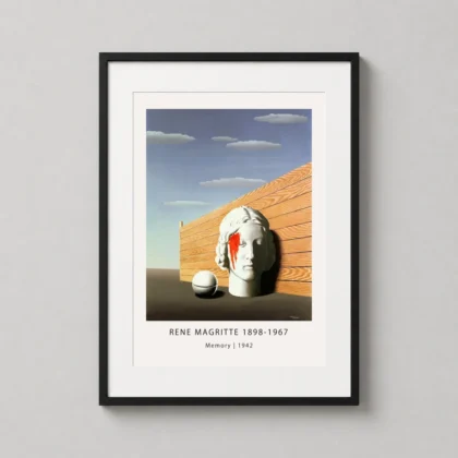 A framed Magritte Memory art print with a marble head subject hanging on a minimalist living room wall.