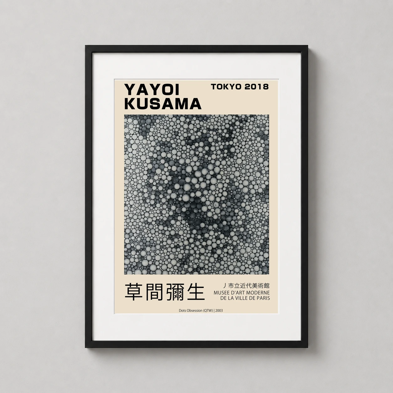 Room mockup of Yayoi Kusama Dots Obsession 2003 Tokyo Exhibition Art Print, displayed as framed wall art in a living room setting as a portrait print with black and white and cream tones.