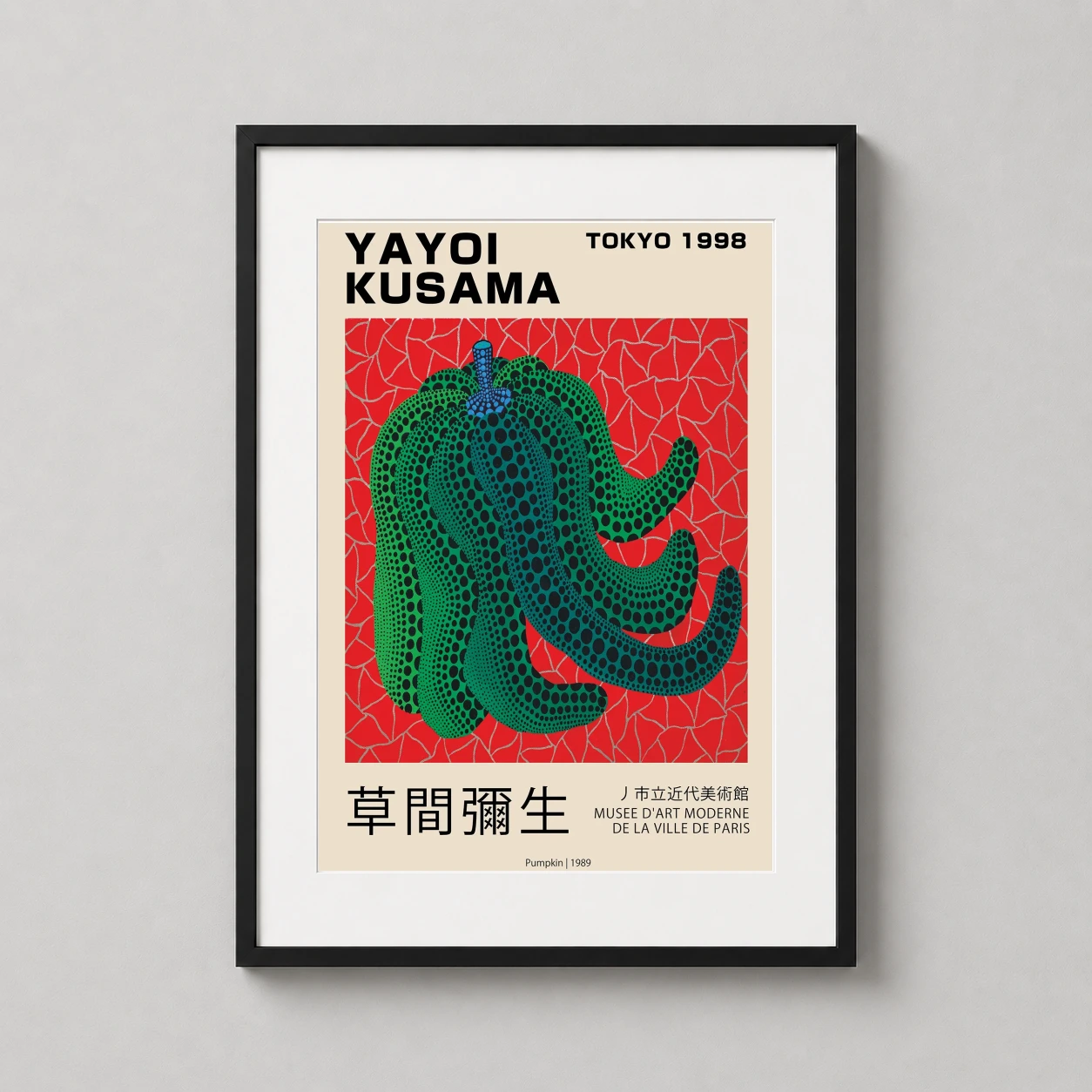 Room mockup of Yayoi Kusama Pumpkin 1989, Tokyo Exhibition Art Print, displayed as framed wall art in a living room setting as a portrait print with green and red tones.