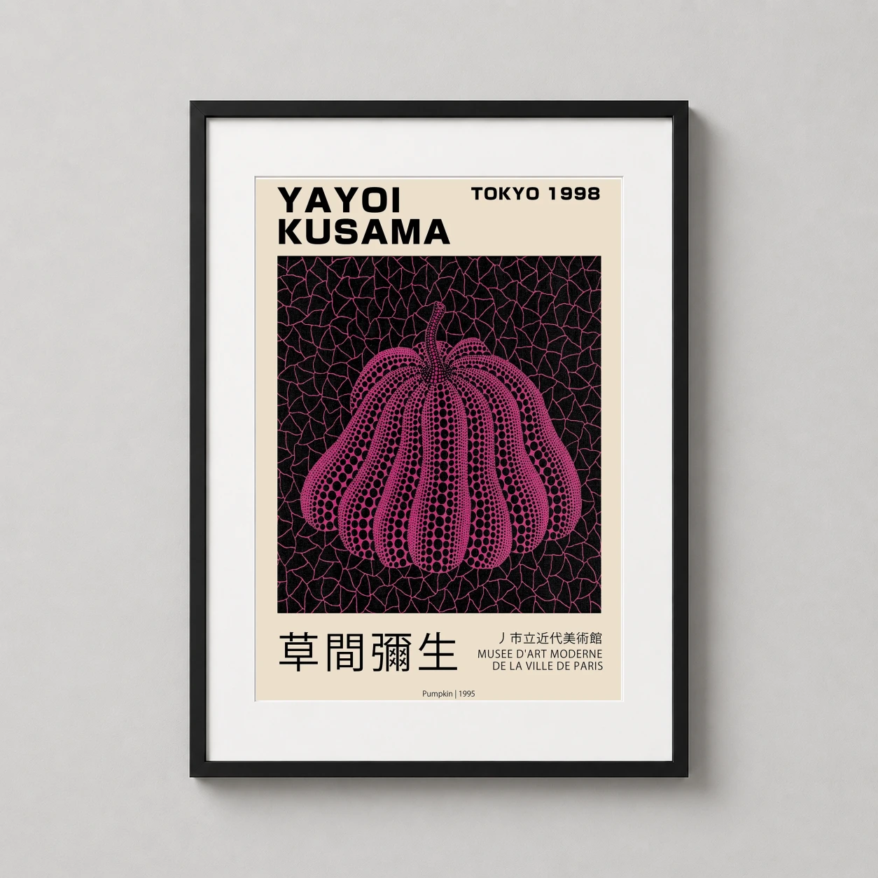Room mockup of Yayoi Kusama Pink Pumpkin Tokyo 1998 Exhibition Art Print, displayed as framed wall art in a living room setting as a portrait print with pink and black tones.
