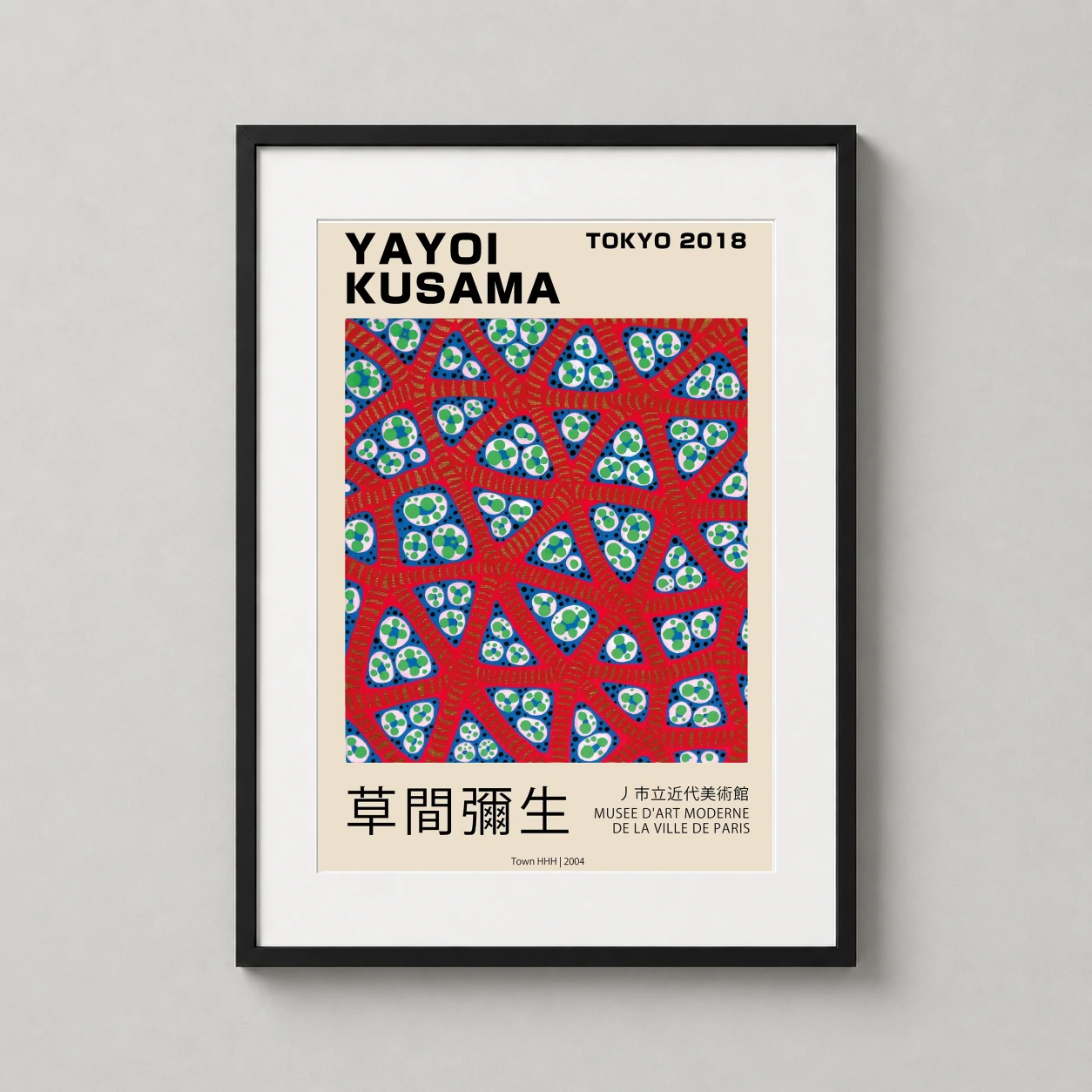 Room mockup of Yayoi Kusama Town HHH 2004 Tokyo Exhibition Abstract Art Print, displayed as framed wall art in a living room setting as a portrait print with blue, green, and red tones.