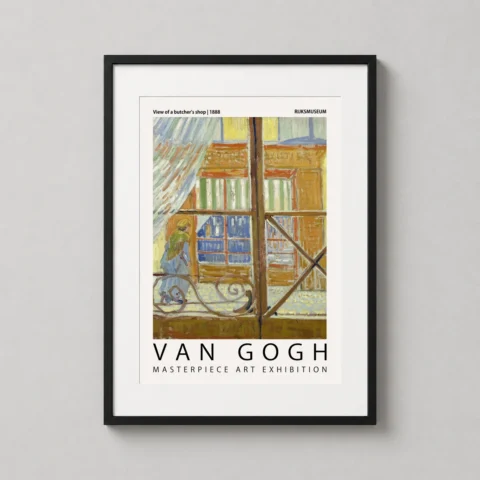 A framed Van Gogh View of a Butcher's Shop art print hanging in a bright modern living room above a minimalist wooden table.