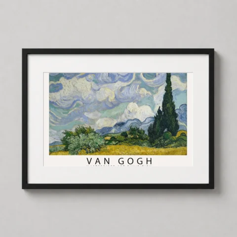 A framed Van Gogh Wheat Field with Cypresses art print hanging on a clean office wall.