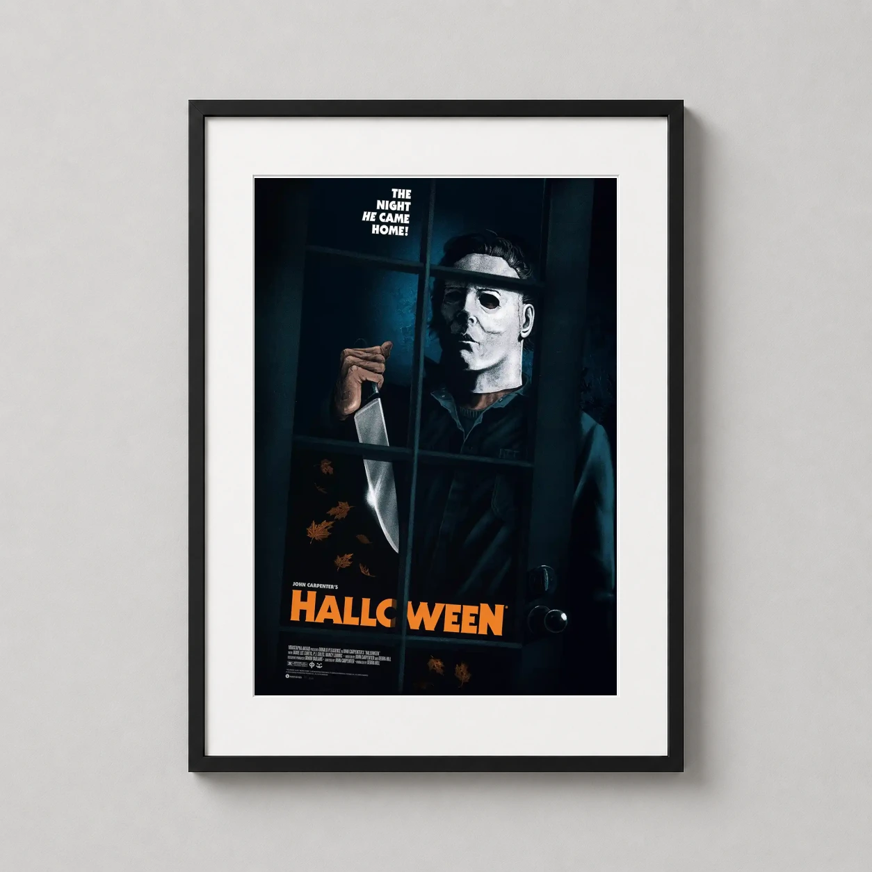 Room mockup of John Carpenter's Halloween Michael Myers Window Slasher Movie Poster, displayed as framed wall art in a home theater setting as a portrait print with blue and brown tones.