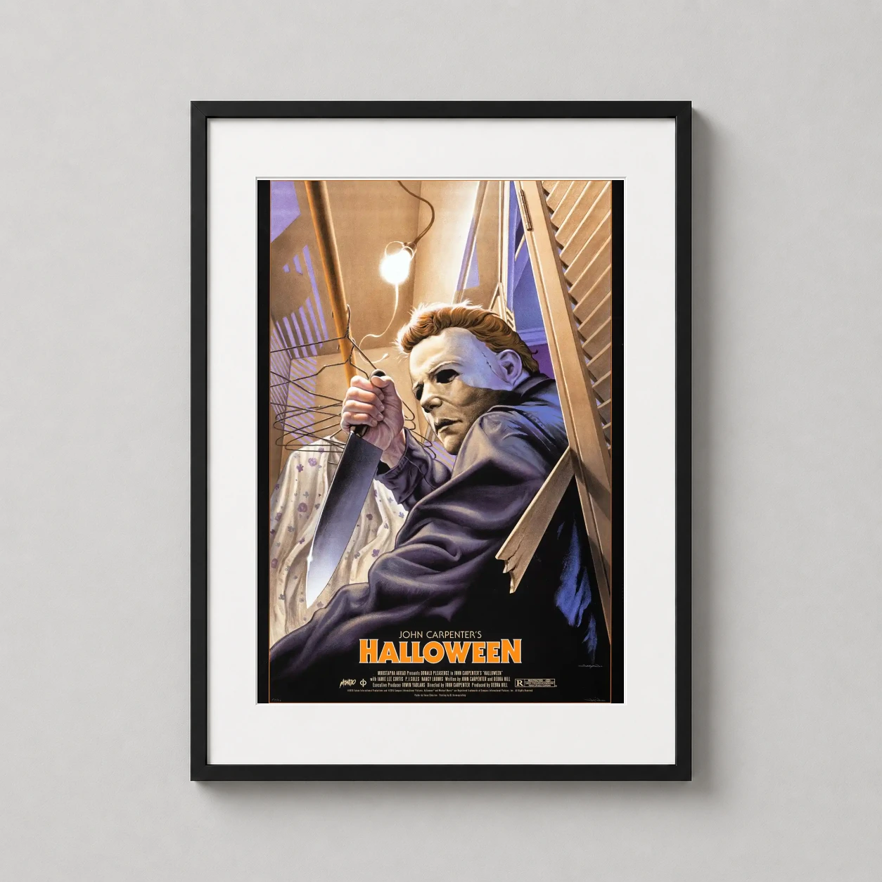 Michael Myers Halloween 1978 — michael Myers looms through a shattered closet door holding a butcher