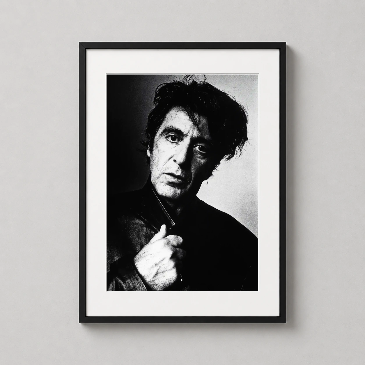 Room mockup of Al Pacino 1995 New York Portrait, Black and White Photography Print, displayed as framed wall art in a office setting as a portrait print with black and white tones.