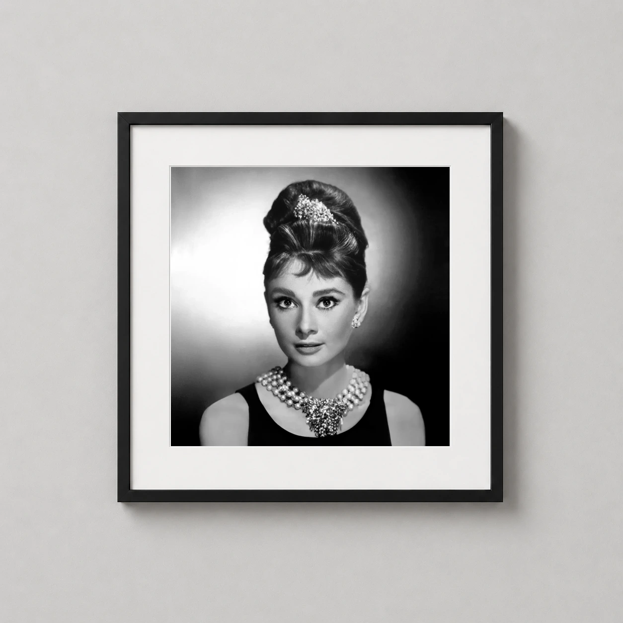 Audrey Hepburn Breakfast Tiffany's — classic black and white studio portrait of Audrey Hepburn as Holly