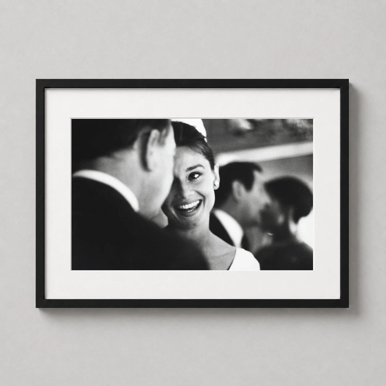 Audrey Hepburn 1960 Lucerne — candid black and white photograph of Audrey Hepburn smiling radiantly