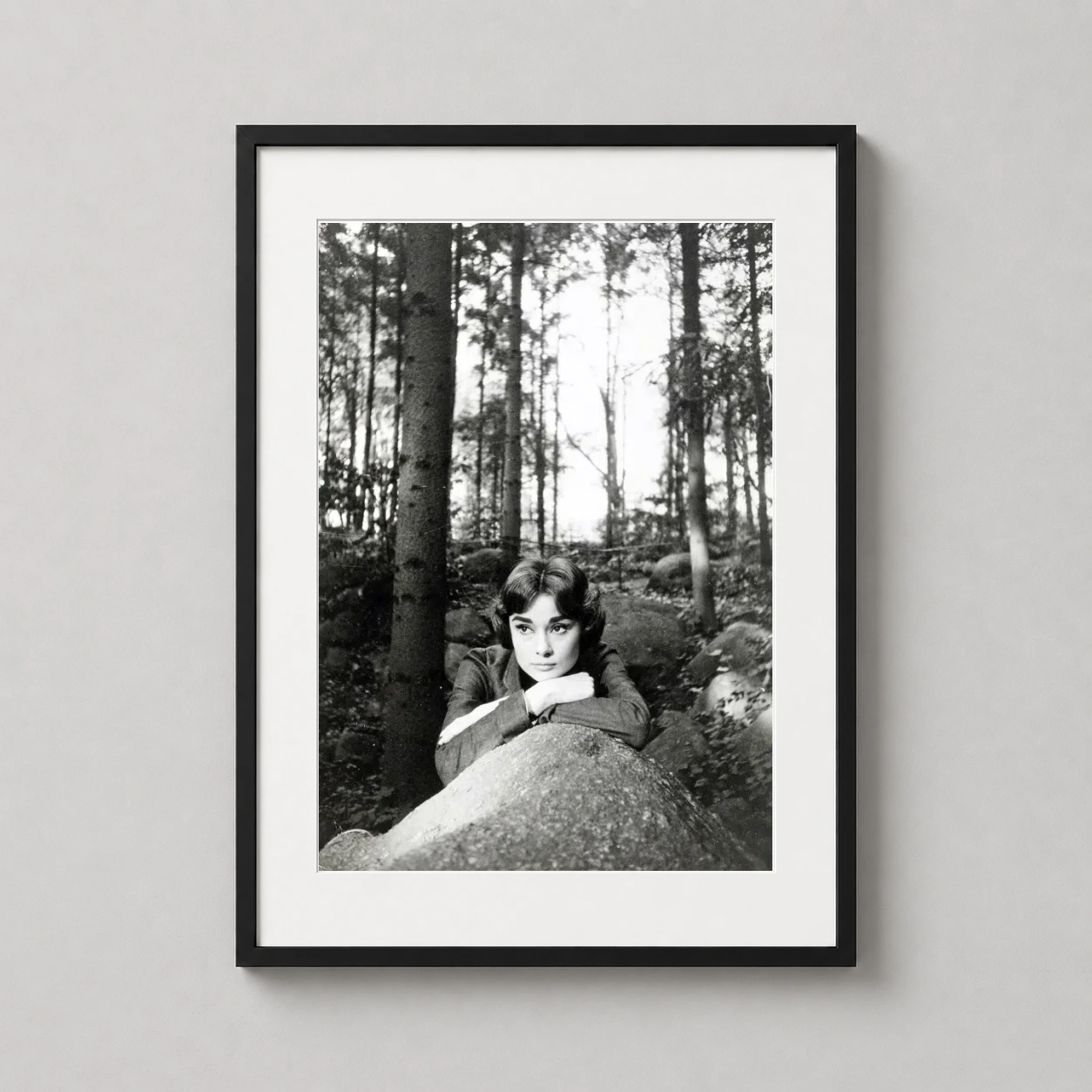 Audrey Hepburn Love Afternoon — contemplative black and white photograph of Audrey Hepburn resting on a