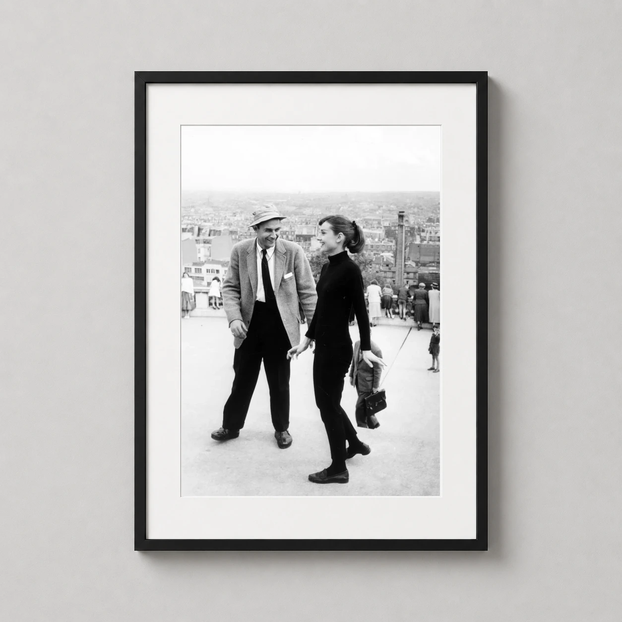 Audrey Hepburn Funny — candid black and white photograph of Audrey Hepburn laughing with a