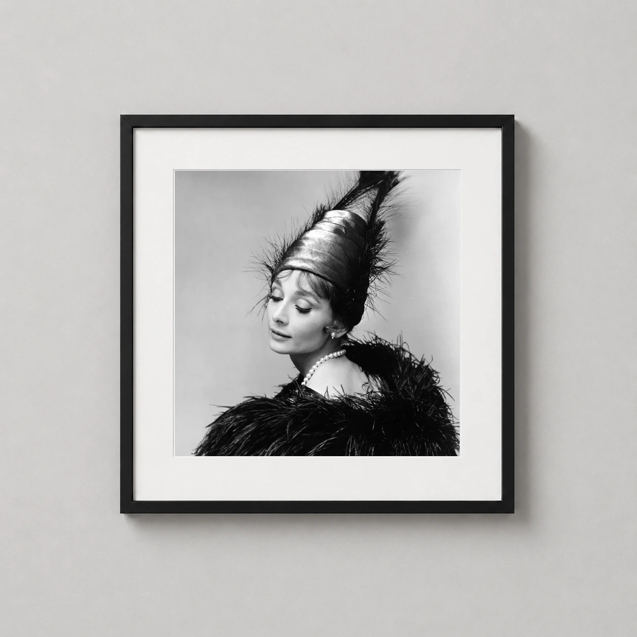 Audrey Hepburn 1963 Paris — monochrome studio portrait of Audrey Hepburn from 1963, featuring a