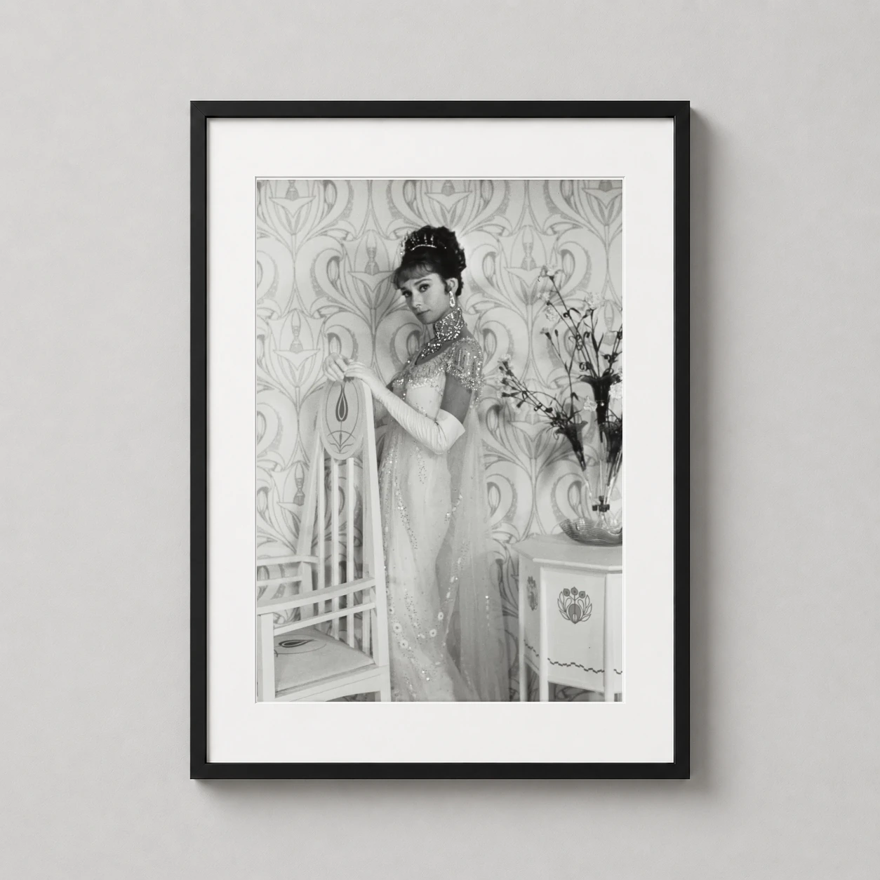 Room mockup of Audrey Hepburn Eliza Doolittle Portrait, My Fair Lady Photography Print, displayed as framed wall art in a home theater setting as a portrait print with black and white tones.