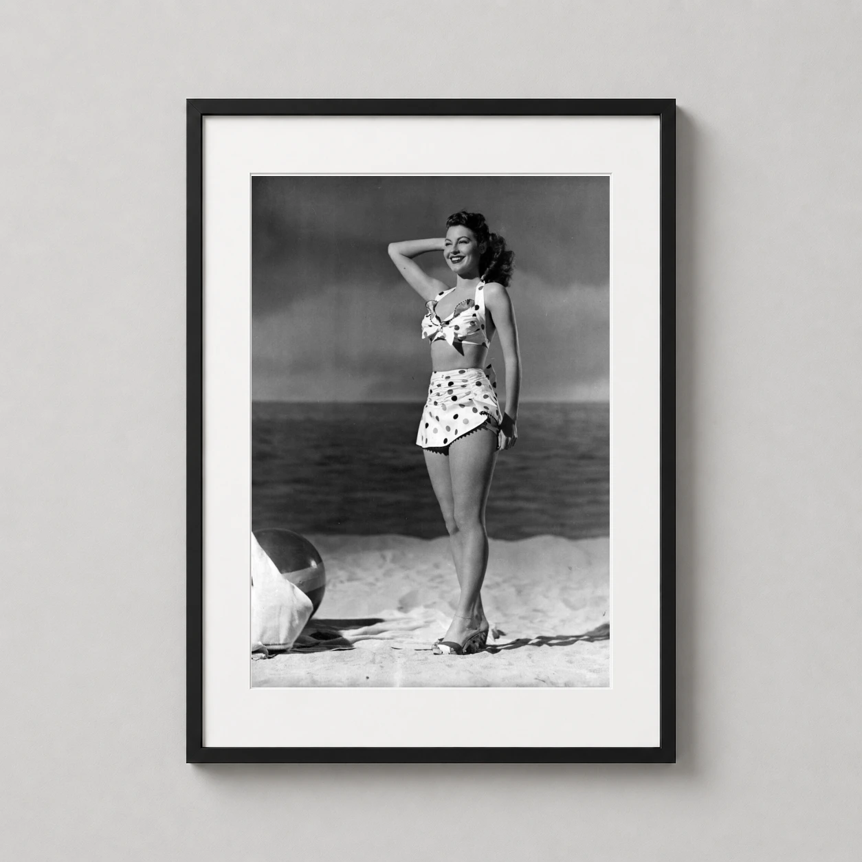 Ava Gardner Beach Polka — joyful black and white photograph of Ava Gardner smiling on a sandy