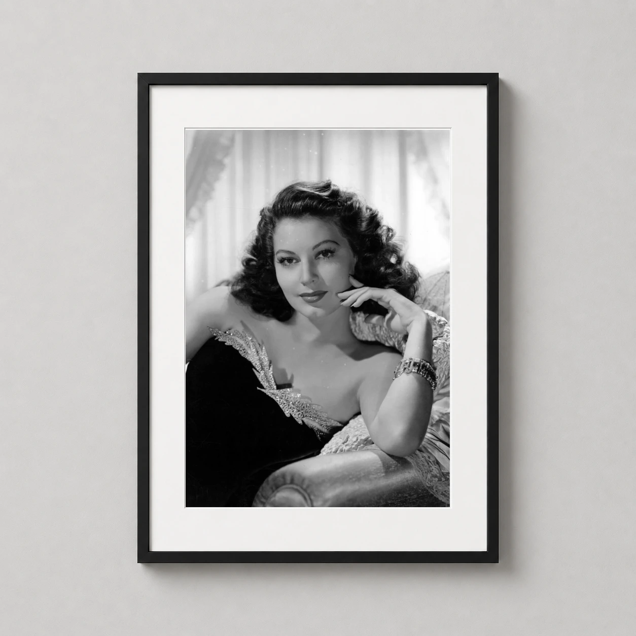 Ava Gardner Glamour Sofa — high-contrast black and white photograph of Ava Gardner reclining on a