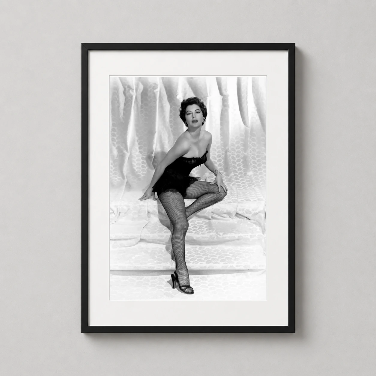 Ava Gardner Black Swimsuit — high-contrast black and white studio photograph of Ava Gardner wearing