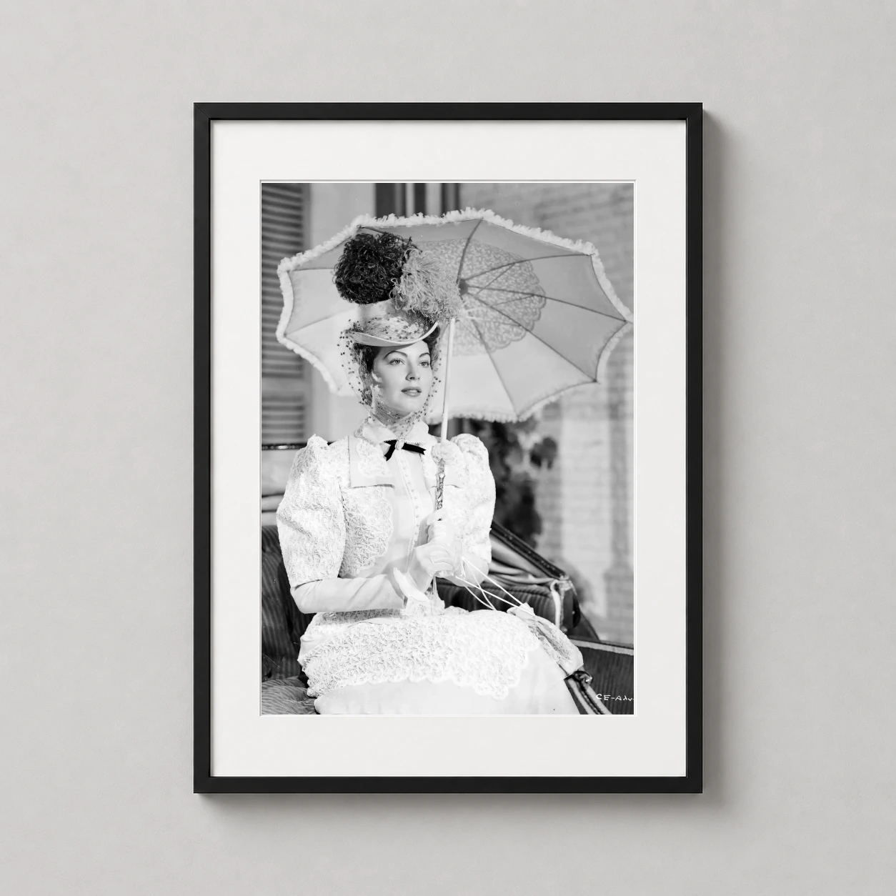 Ava Gardner Hollywood in — striking black and white portrait of Ava Gardner holding an ornate lace