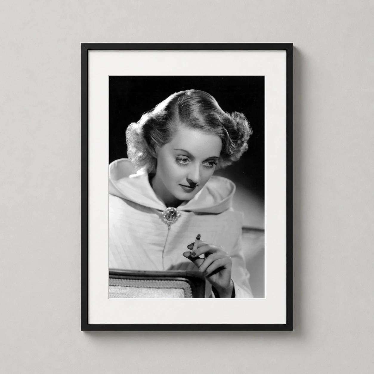 Bette Davis Smoking Portrait — sophisticated black and white portrait of actress Bette Davis holding a