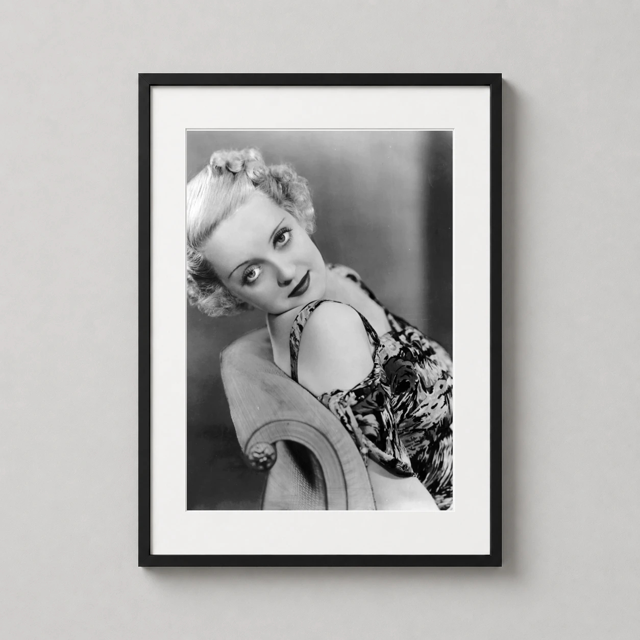Bette Davis — sophisticated black and white studio portrait of Bette Davis from the